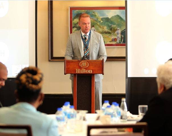  Political affairs officer at the US Embassy in Trinidad and Tobago, John Miller, delivers opening remarks at the presentation of 2022 DTM findings.