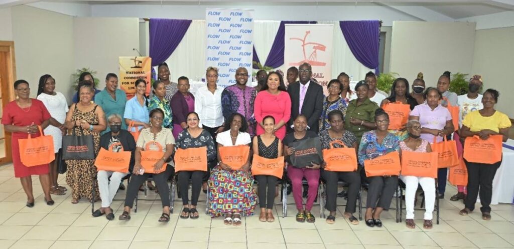 Group of women grant recipients along with the Shamfa Cudjoe, Minister of Sport and Community Development and  Adrian Winter, chairman, National Commission for Self Help Limited. - 