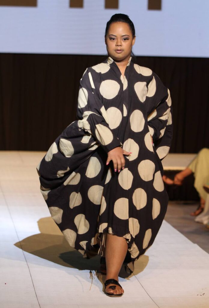 A Down syndrome model walks the catwalk in a design by The Cloth at the Fashion for Us hosted by the Down Syndrome Family Network at the Hyatt Regency, Port of Spain. Photo by Angelo Marcelle