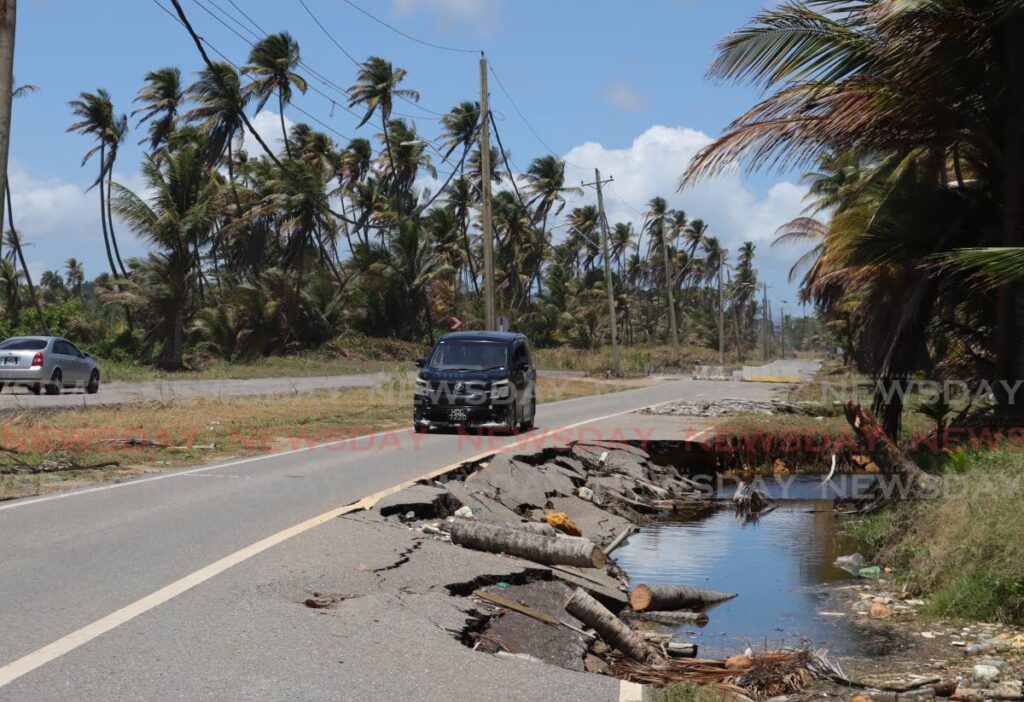This driver uses a section of the collapsed Manzanilla/Mayaro Road, to avoid the potholes along the temporary road.  - ROGER JACOB
