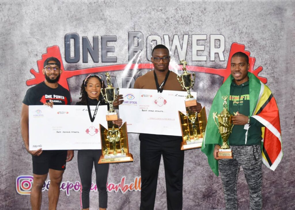 (L-R)  Owner of the One Power Barbell gym 
Dr Krystan Hosein stands alongside Ruth Li (Best Female Lifter), Caleb Thomas-Alexis (Best Male Lifter) and Dominic Tyrell (Best Guest 
Lifter) ,on Saturday, at the One Power Barbell Classic 2023, at Eastern Main Road, D’ Abadie. - One Power Barbell Gym