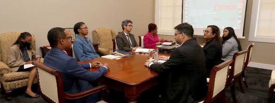 LET’S TALK: Foreign and Caricom Affairs Minister Dr Amery Browne, seated left at the table, during his meeting with executive members of the TT Coalition of Services Industries last week. Photo courtesy Foreign and Caricom Affairs Ministry