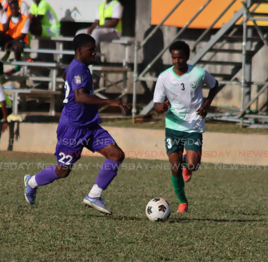 AC Port of Spain’s Jameel Neptune (L) goes past Prisons Fc’s Matthew Dufeal during the TT Premier Football League round four match, on Sunday, at the Police Barracks, St James.  - ROGER JACOB