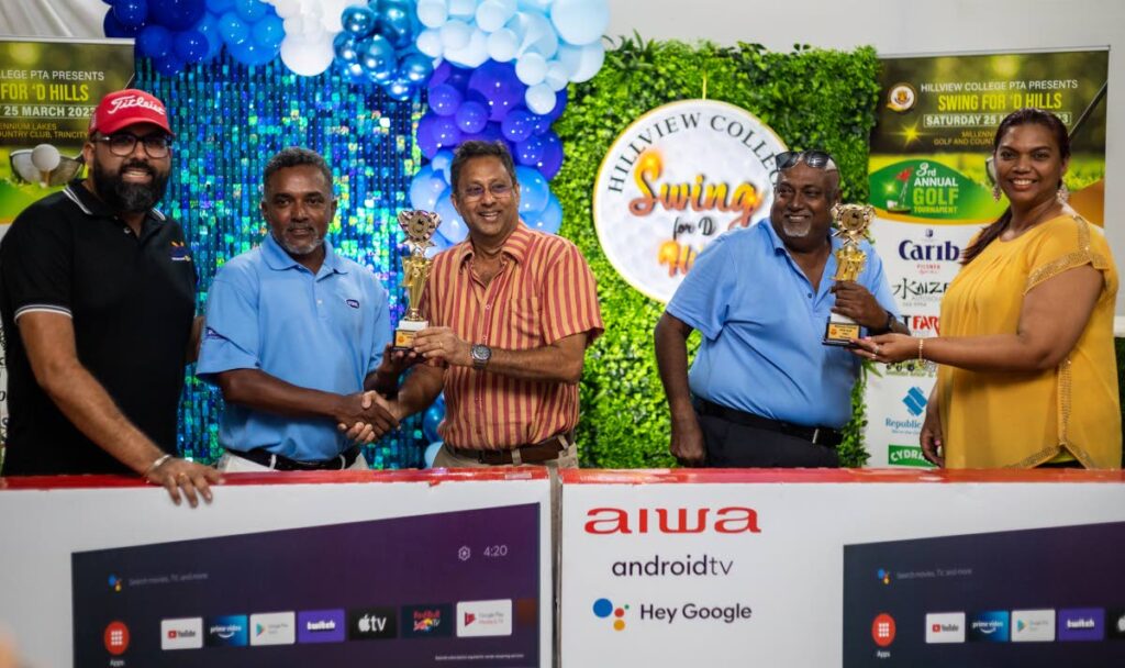 Swing For D Hills champs Rodney Phillip, second from left, and Jai Chandool, second from right, receive their trophies and prizes from first-prize sponsor Upendra Udharamaney, corporate manager, St Augustine Medical Lab, left, former Hillview principal Leslie Mahase, centre, and Hillview acting VP Sharon Ramdeen, at Saturday's prize-giving ceremony, Millenium Lakes Golf Club clubhouse, Trincity. - Nathan Nancoo