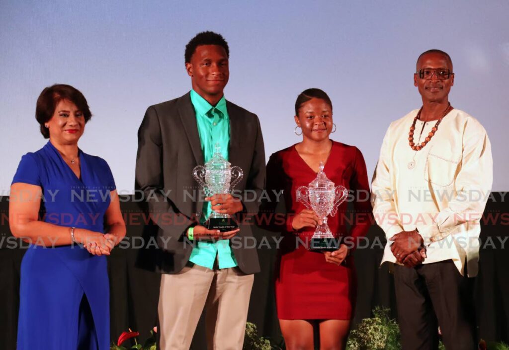 EXCELLENCE: Youth Sportsman of the Year Nikoli Blackman, second from left, and Youth Sportswoman of the Year Phoebe Sandy, second from right, with their awards alongside Karen Darbasie, Group CEO, First Citizens and Major David Benjamin,  committee member, First Citizens Sports Foundation, at Sunday’s annual First Citizens Sports Foundation awards ceremony, Movietowne, Port of Spain. - ROGER JACOB