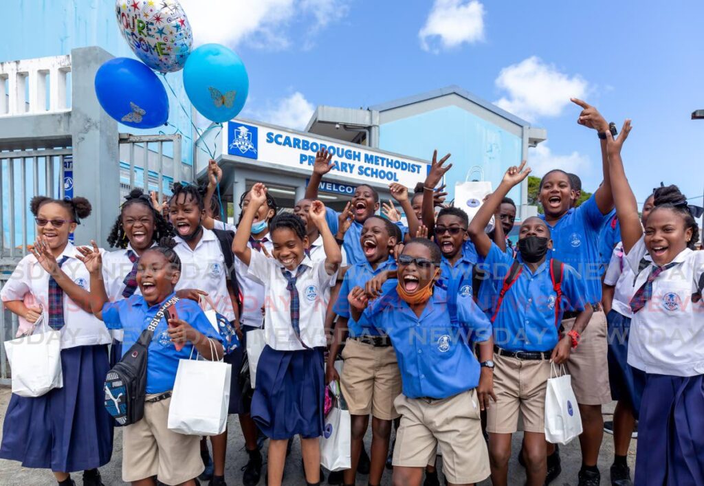 IT'S OVER: Students jump for joy after SEA exams at Scarborough Methodist Primary School, Calder Hall, Tobago, Wednesday. - Photo by David Reid