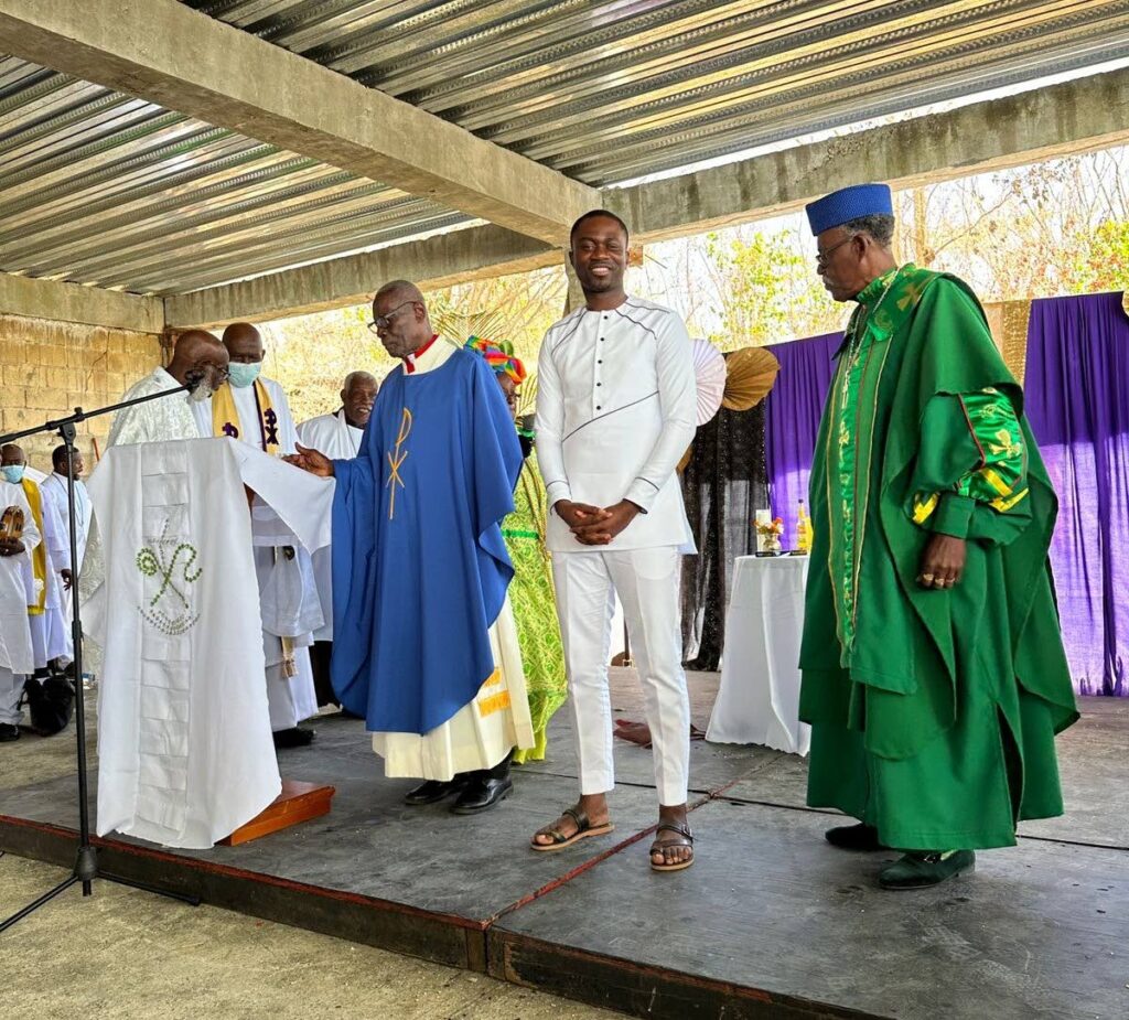 THA Chief Secretary farley Augustine (centre) is surrounded by Spiritual Baptist leaders during Liberation Day celebrations at Signal Hill, Tobago on Thursday. - Kimmi Potts