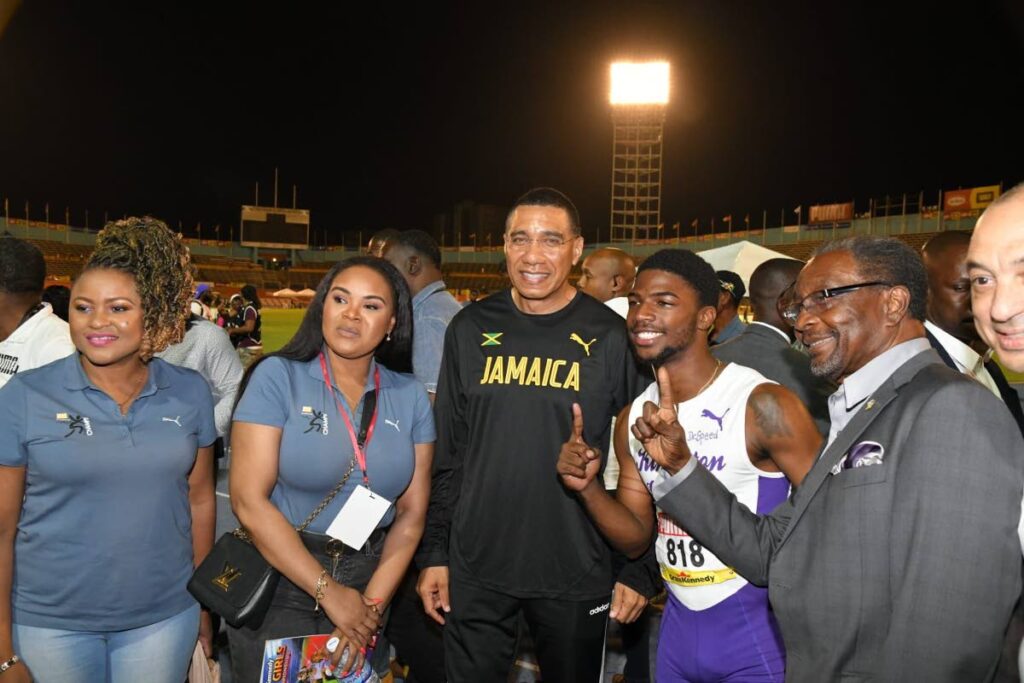 Education Minister Dr Nyan Gadsby-Dolly and Sport Minister Shamfa Cudjoe take a photo with Jamaican Prime Minister Andrew Holness (centre), Kingston College sprinter Bouwahjie Nkrumie, US ambassador to Jamaica Nick Perry and CEO of GraceKennedy Ltd  Don Wehby. - Andrew Holness's Facebook page