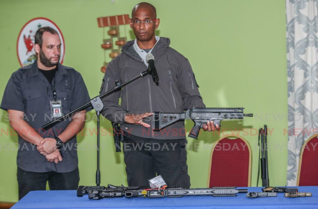In this August 2021 file photo, CEO Dirk Barnes of 868 Tactical Firearms and Accessories explains firearms safety and classifications using a Grand Power Stribog SR9 A3. At left, is firearms trainer consultant Paul Nahous, a former consultant with the police service. - Jeff K. Mayers
