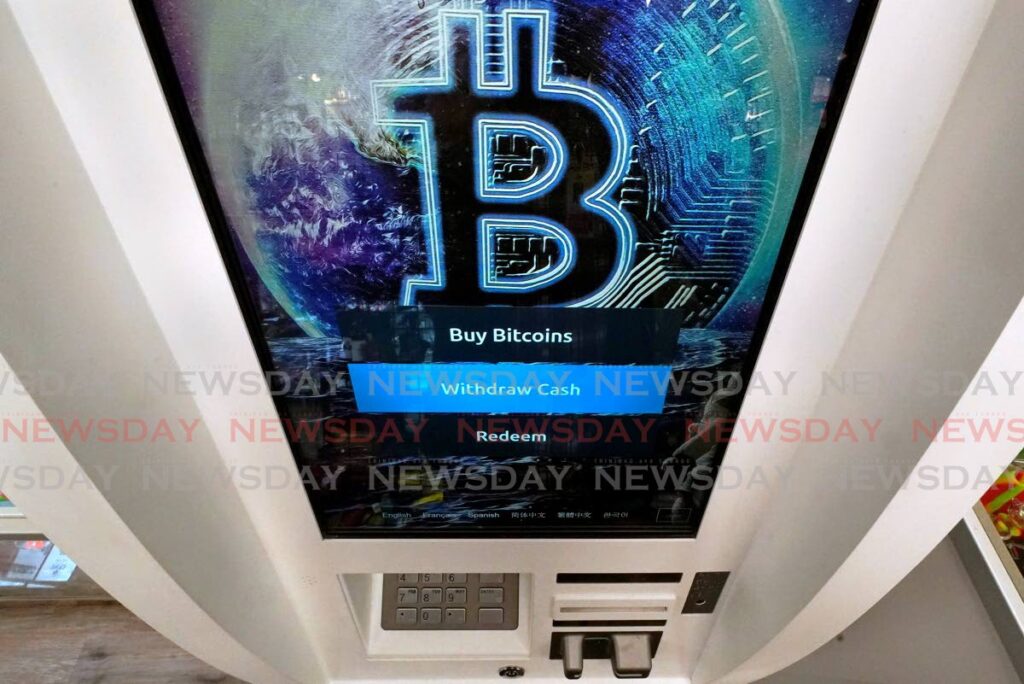  In this February 9, 2021, file photo, the Bitcoin logo appears on the display screen of a cryptocurrency ATM at the Smoker's Choice store in Salem, New Hampshire. - AP Photo  