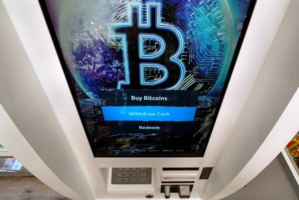  In this February 9, 2021, file photo, the Bitcoin logo appears on the display screen of a cryptocurrency ATM at the Smoker's Choice store in Salem, New Hampshire. AP Photo - 