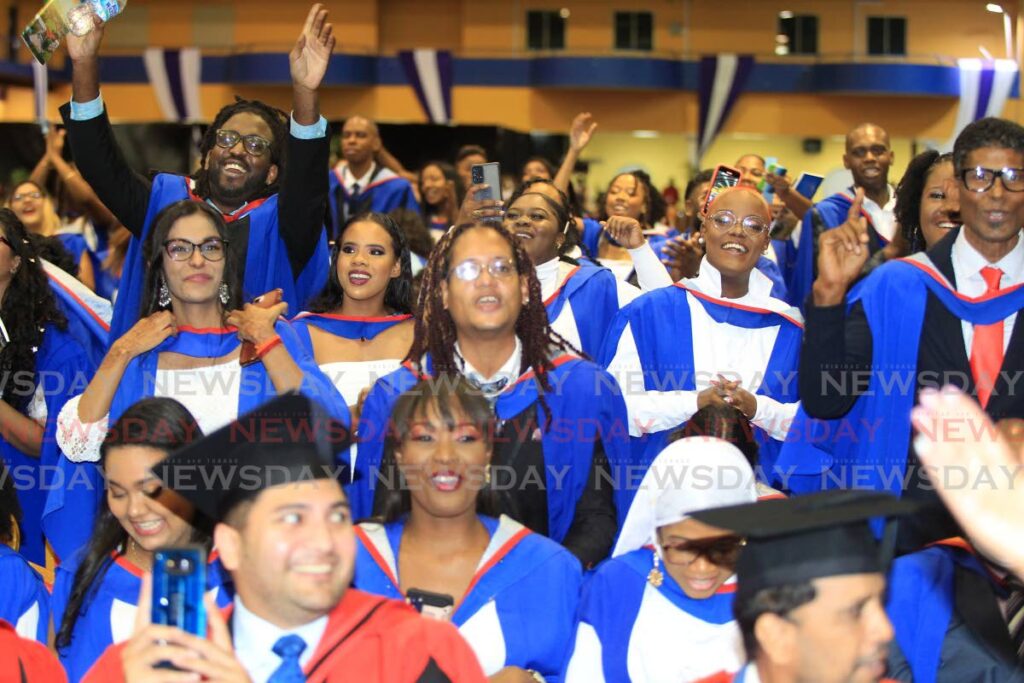 UWI graduates celebrate at the ceremony at the St Augustine campus on October 29, 2022. - ROGER JACOB