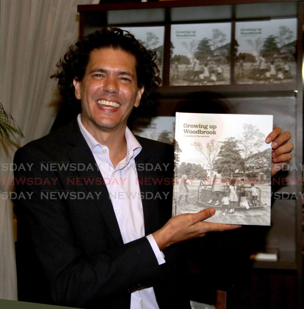 Dr Dylan Kerrigan with his book Growing up in Woodbrook. - 