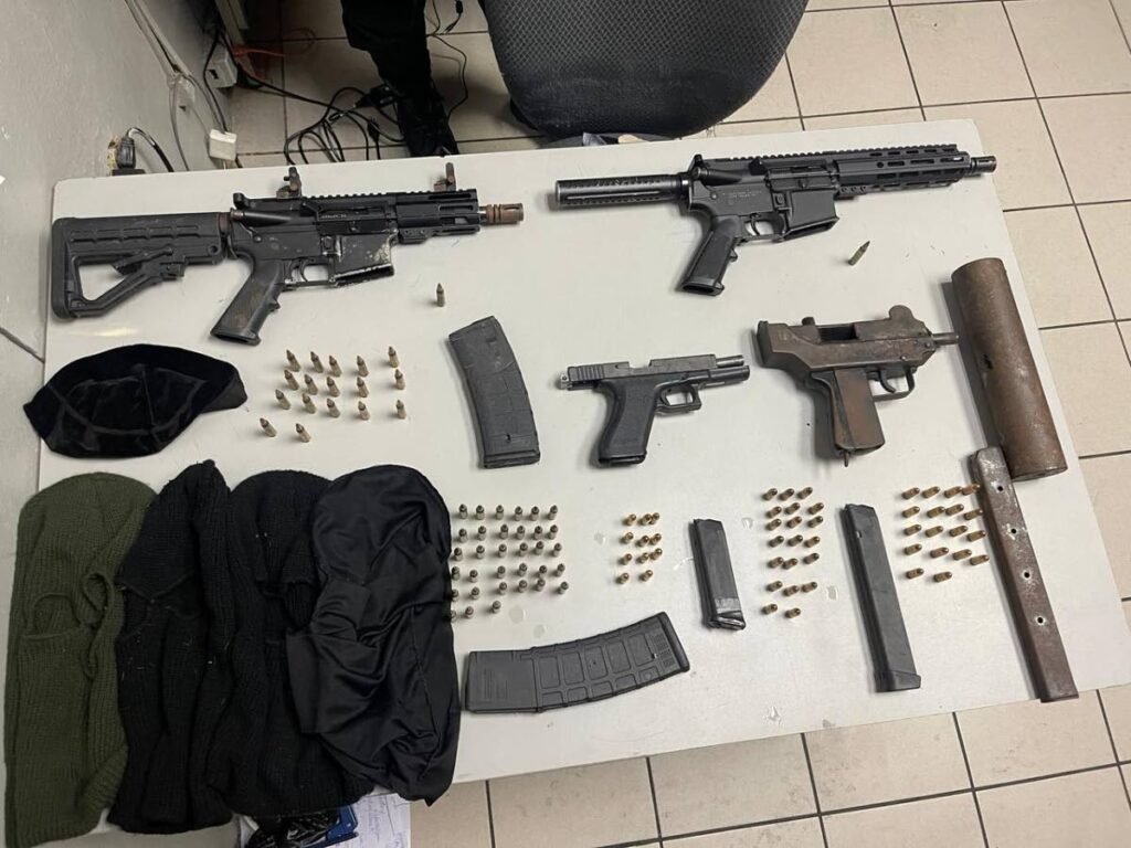 Guns and ammunition seized by police during an exercise in Tunapuna in February. POLICE PHOTO - 