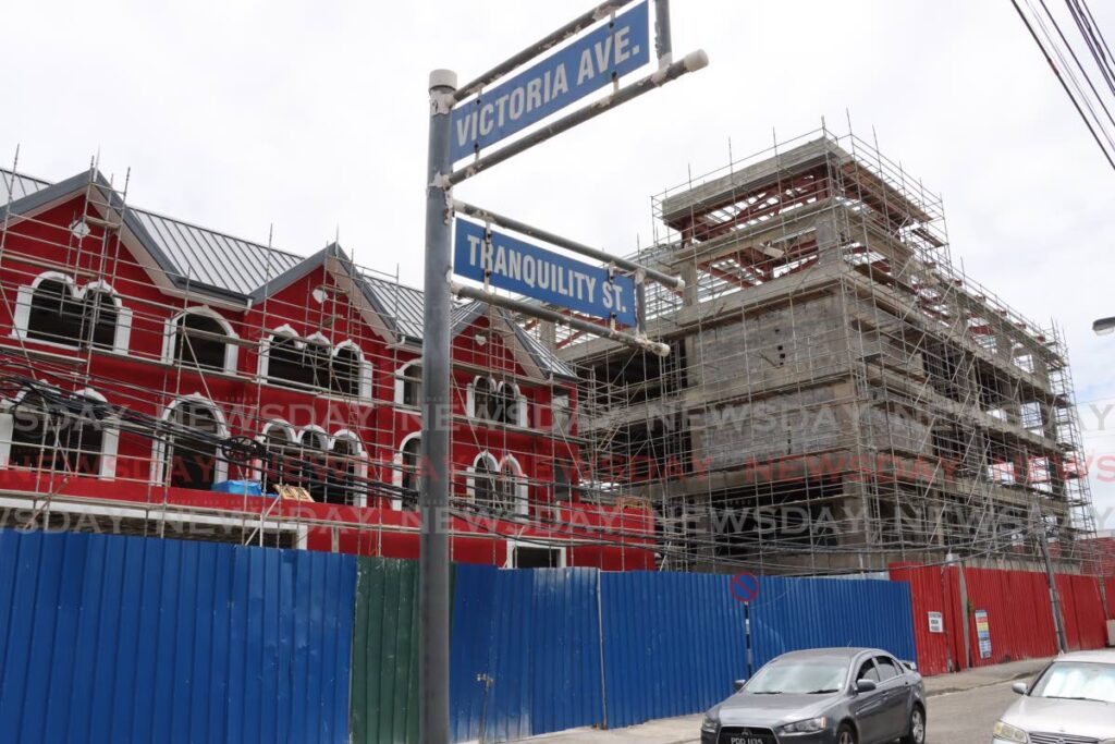 Scaffolding surround the unfinished building at the corner of Victoria Avenue and Tranquility Street, in Port of Spain where the new head office of the PNM is being constructed. - Roger Jacob