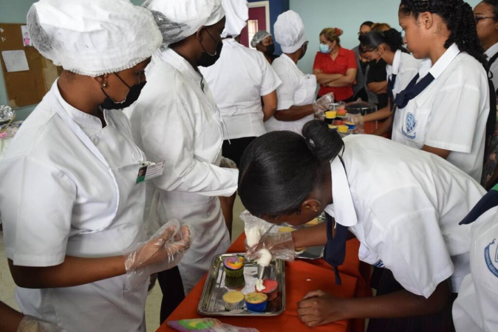 At the Princes Town East Secondary School students were exposed to and participated in simulations in cake decorating air condition and refrigeration, beauty therapy, building electrical among others. - 