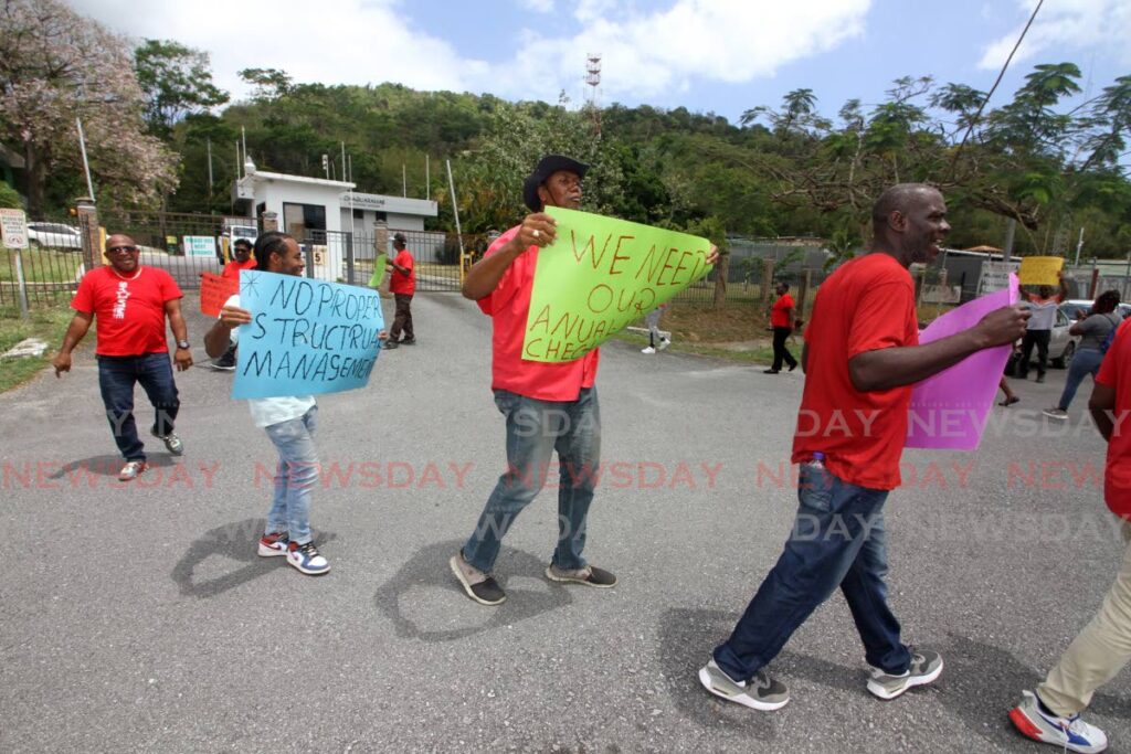 Workers during their protest on Tuesday outside the Chaguaramas Development Authority (CDA). PHOTO BY ANGELO MARCELLE - 
