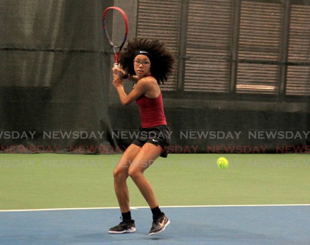 American Ligaya Murray returns the ball to Reese Calvo during the ITF World Junior Tennis tournament at the National Racquet Centre, Tacarigua, Tuesday. - AYANNA KINSALE