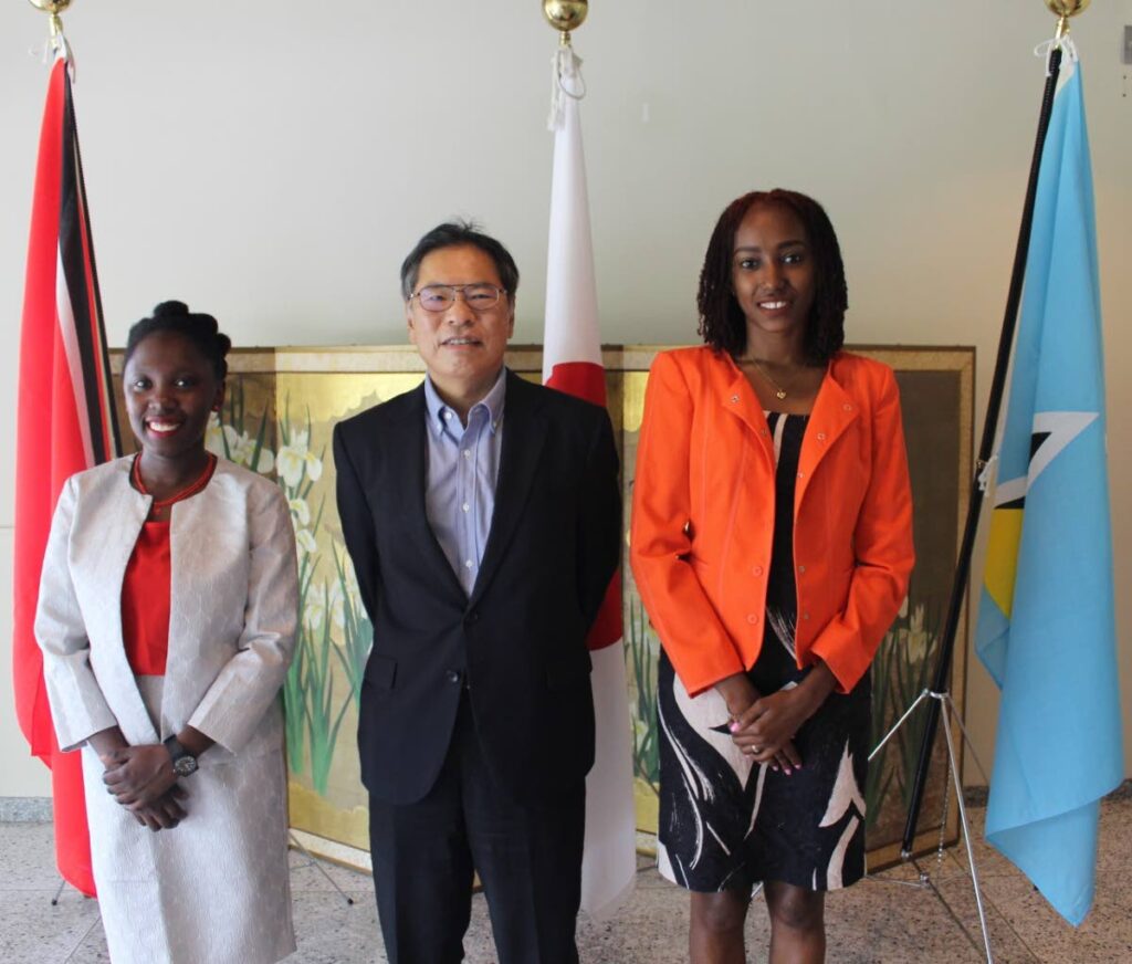 Early departure JET 2023 participant Terri-Ann Young, left,  Yasuhiko Kamada, deputy ehad of mission, Japanese Embassy and MEXT Scholarship 2023 participant Melanie Griffith-Quintyn. - 