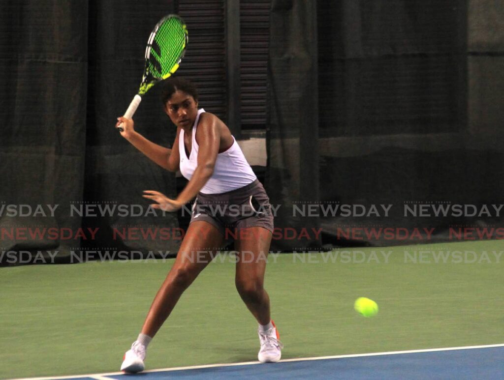 Kayla Brianne Moore get ready to return the ball during in the ITF World Tennis Tour at the National Racquet Centre, Tacarigua on April 5. - AYANNA KINSALE