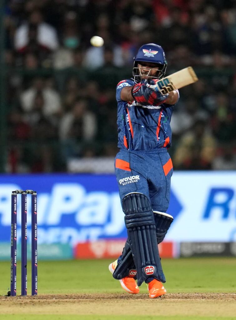 Lucknow Super Giants' Nicholas Pooran hits a boundary during the Indian Premier League match vs Royal Challengers Bangalore in Bengaluru, India, Monday. - AP