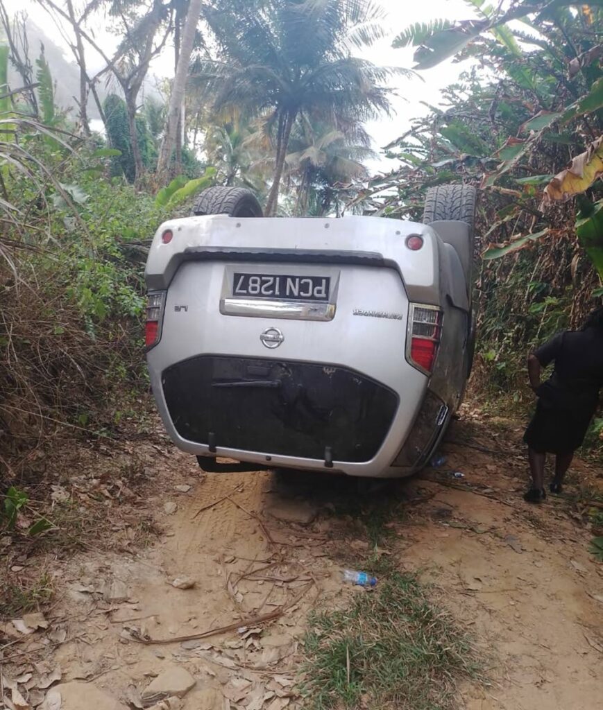 A Nissan Pathfinder SUV overturned while driving on the Paragrant Beach Road, off the North Coast Road, Maracas, on Tuesday. - 