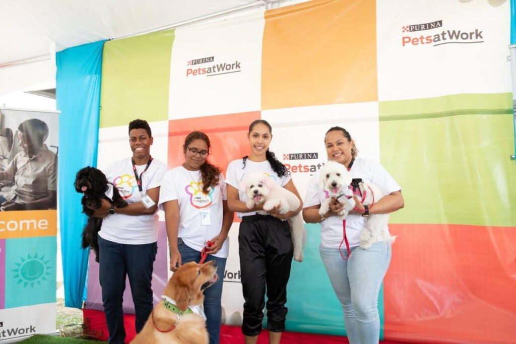 Sharing the spotlight with their favourite little ones  at the Nestle office are (from left) Nannika Honore and Smoke, Gabriela de Matas and Marley and Cassia Precilla and Chinadoll  and Ambika Compton and Brandy. - Photo courtesy Nestle 