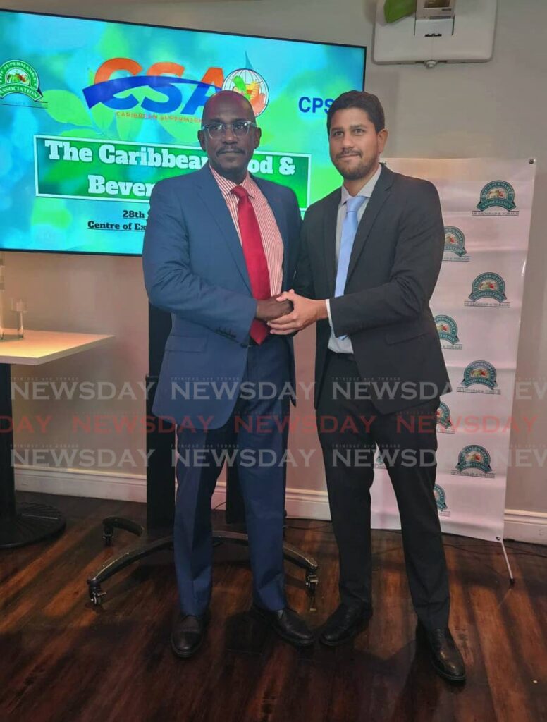 Caricom Private Sector Organisation CEO Dr Patrick Antoine and chair of the Caribbean Supermarkets Association Rajiv Diptee at the launch of the Caribbean Food and Trade Show on April 12 - Yvonne Webb