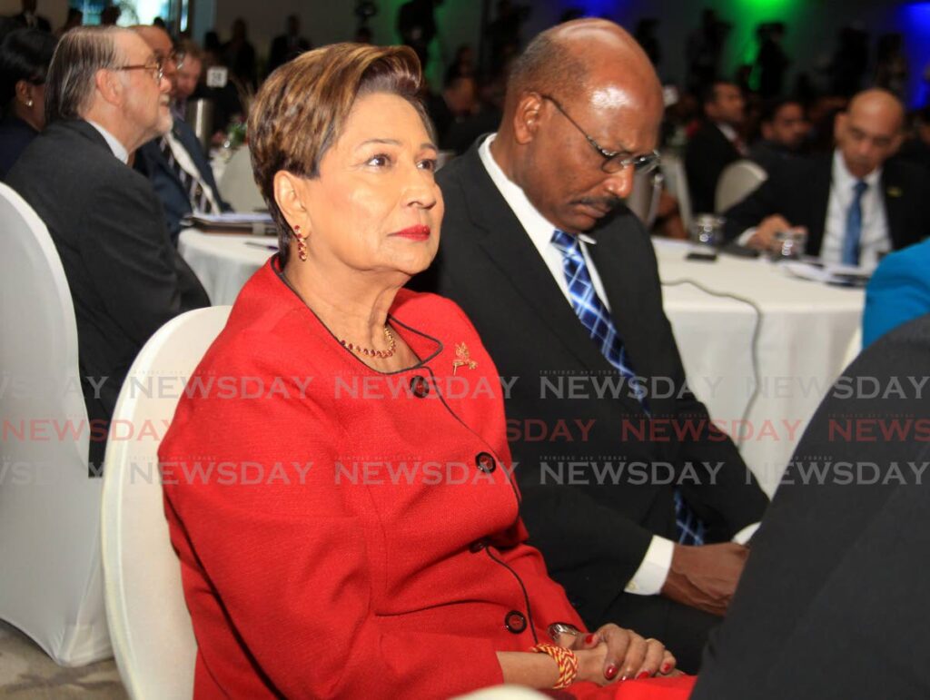 PAYING ATTENTION: Opposition Leader Kamla Persad-Bissessar attends the Caricom crime symposium on Monday at the Hyatt Regency in Port of Spain. Hours later, while speaking at the UNC's Monday Night Report, she described the talks as a waste of time. PHOTO BY AYANNA KINSALE  - 