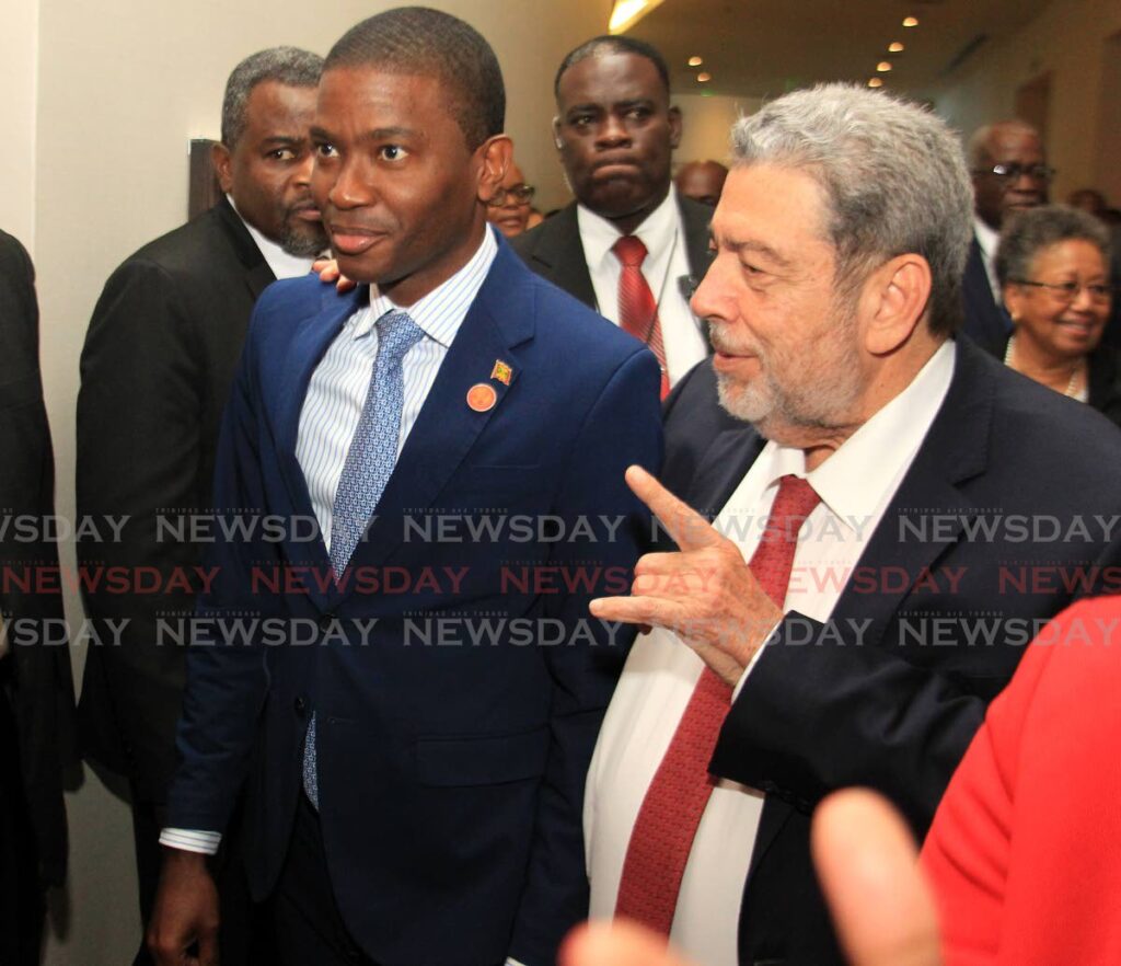 St Vincent and the Grenadines Prime Minister Dr Ralph Gonsalves, right, and Grenada Prime Minister Dickon Mitchell at the Caricom crime symposium, Hyatt Regency, Port of Spain on Monday. - AYANNA KINSALE