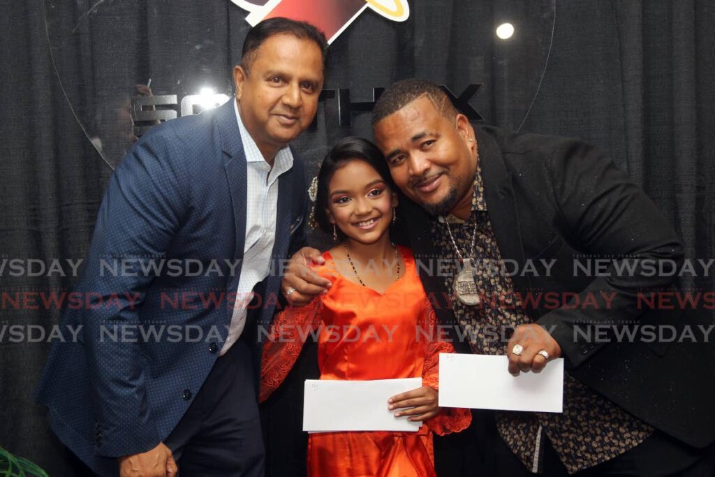 Southex CEO George Singh, left, chutney soca queen Katelin Sultan, nine, and chutney soca king Ricardo “Daddy Chinee” Melville at the Southex office in San Fernando on Wednesday. 
Photo by Lincoln Holder