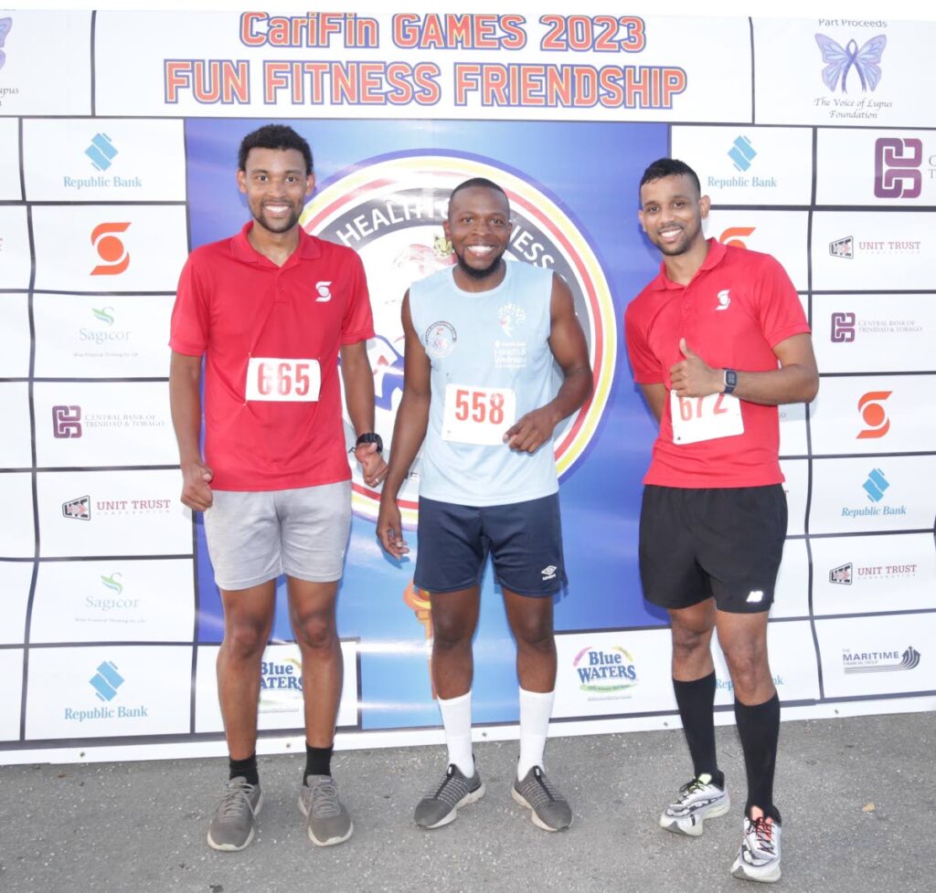 CariFin Games 1 Lap Savannah champ Abijah Phillip, centre, with runner-up Clinton Williams, right and third-placed Shay Gonzales. - 