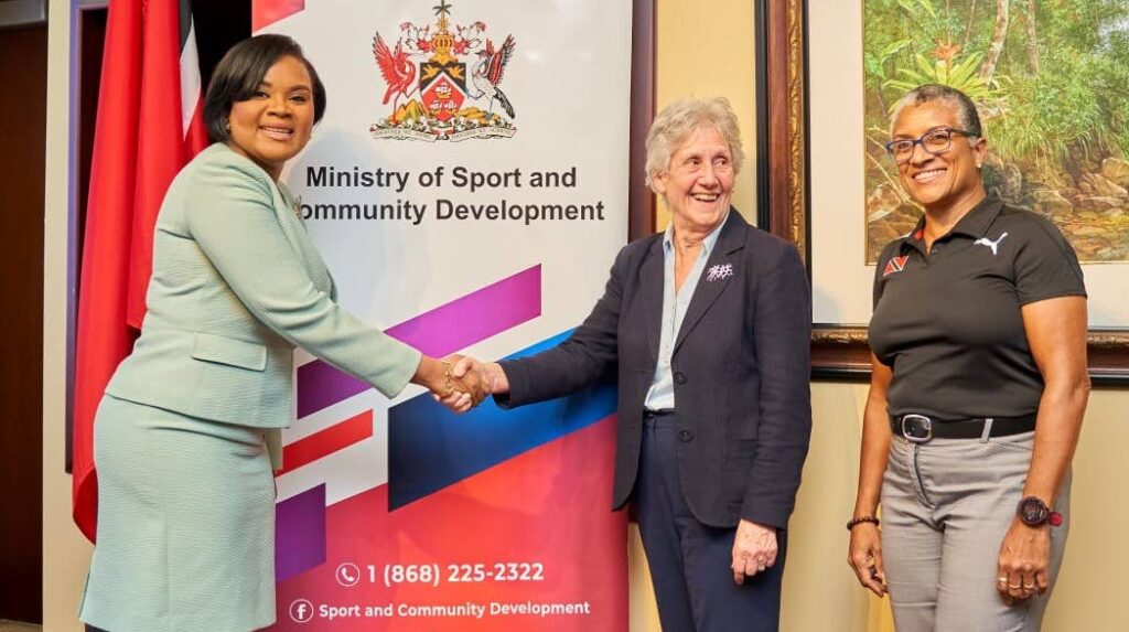 Minister of Sport and Community Development Shamfa Cudjoe, left, greets Commonwealth Youth Games president Dame Louise Martin as TTOC president Diane Henderson looks on during a meeting on Monday at the ministry, Port of Spain. Photo courtesy Ministry of Sport and Community Development  - 