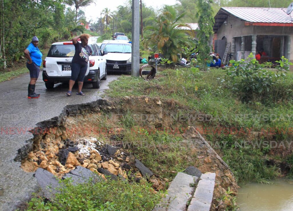 Nicole Ali looks at the river near her home on Mandillon Road, Sangre Grande, on Wednesday