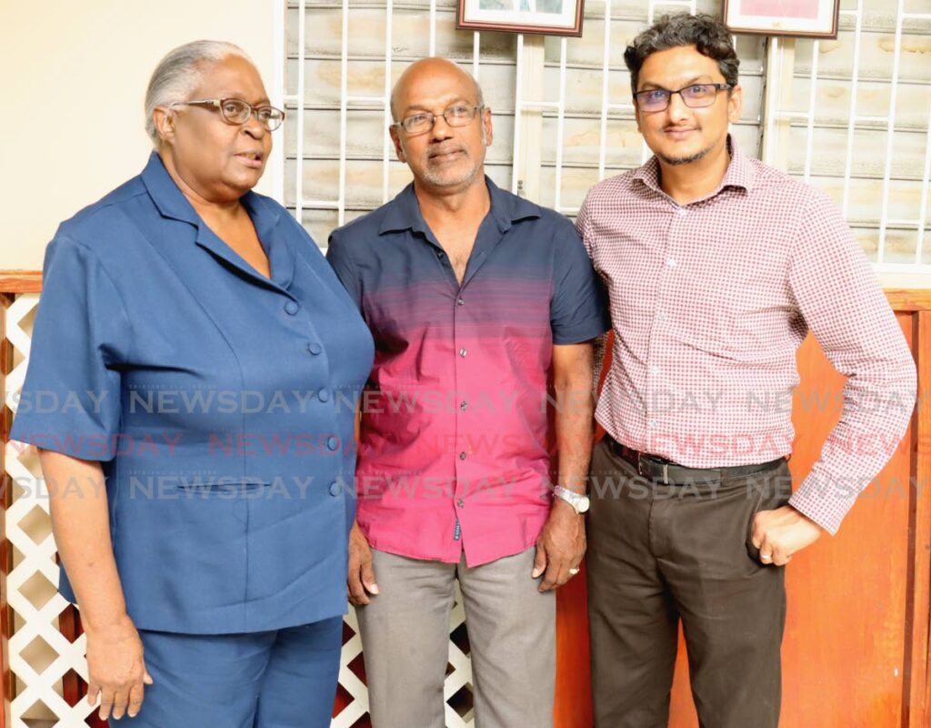 Clinton Sahadeo, centre, Junia Walcott, left, and Dr Adesh Lutchman, claim to have been elected as the new president, general secretary and vice-president, respectively, of the Pharmacy Board of TT after a meeting between members of the board at the Professional Business Centre, Port of Spain, on Thursday. - Photo by Roger Jacob