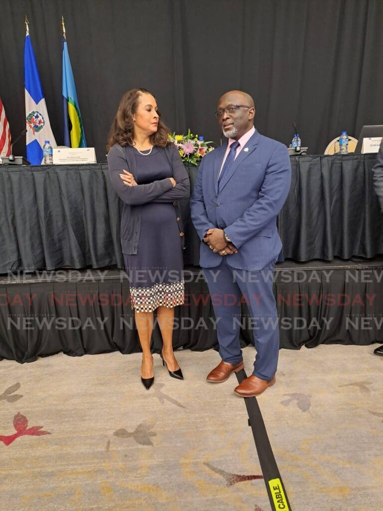 US Ambassador to TT Candace Bond chats with Executive Director of Caricom Implementation Agency For Crime And Security (IMPACS) Lt Col Michael Jones at the closing of the three day conference on illegal guns in the region