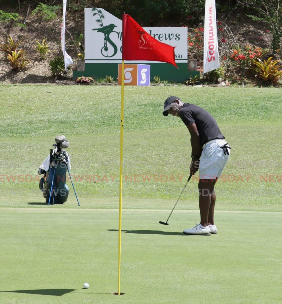 Former national footballer Trent Noel misses a putt while competing at the Scotiabank Charity Golf Tournament on Friday. - ROGER JACOB