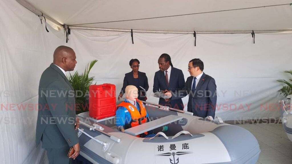 From left, Chinese Ambassador to TT Fang Qui chats with National Security Minister Fitzgerald Hinds at ODPM's Mausica office after donating emergency response equipment. Looking on are ODPM CEO Major Gen (ret'd) Rodney Smart, right, and Permanent Secretary in the Ministry of National Security Nataki Atiba-Dilchan - Photo by Jensen La Vende