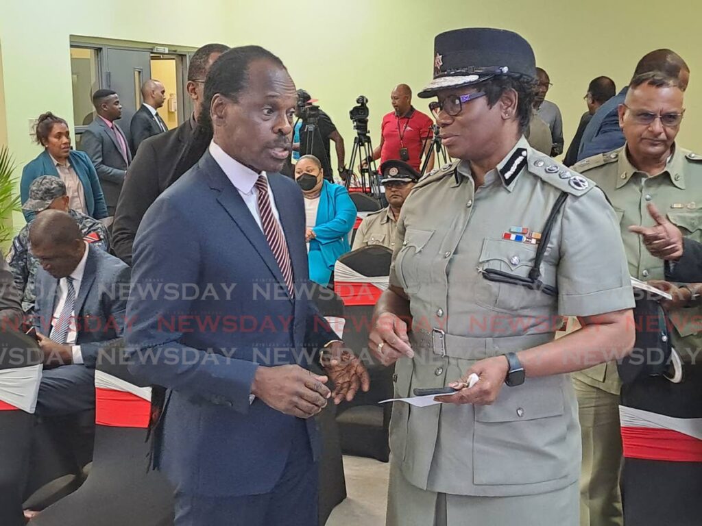 National Security Minister Fitzgerald Hinds speaks with Police Commissioner Erla Harewood-Chrsitopher at the handing over ceremony of emergency response equipment by the Chinese ambassador at the ODPM's Mausica office on Friday. - Jensen La Vende