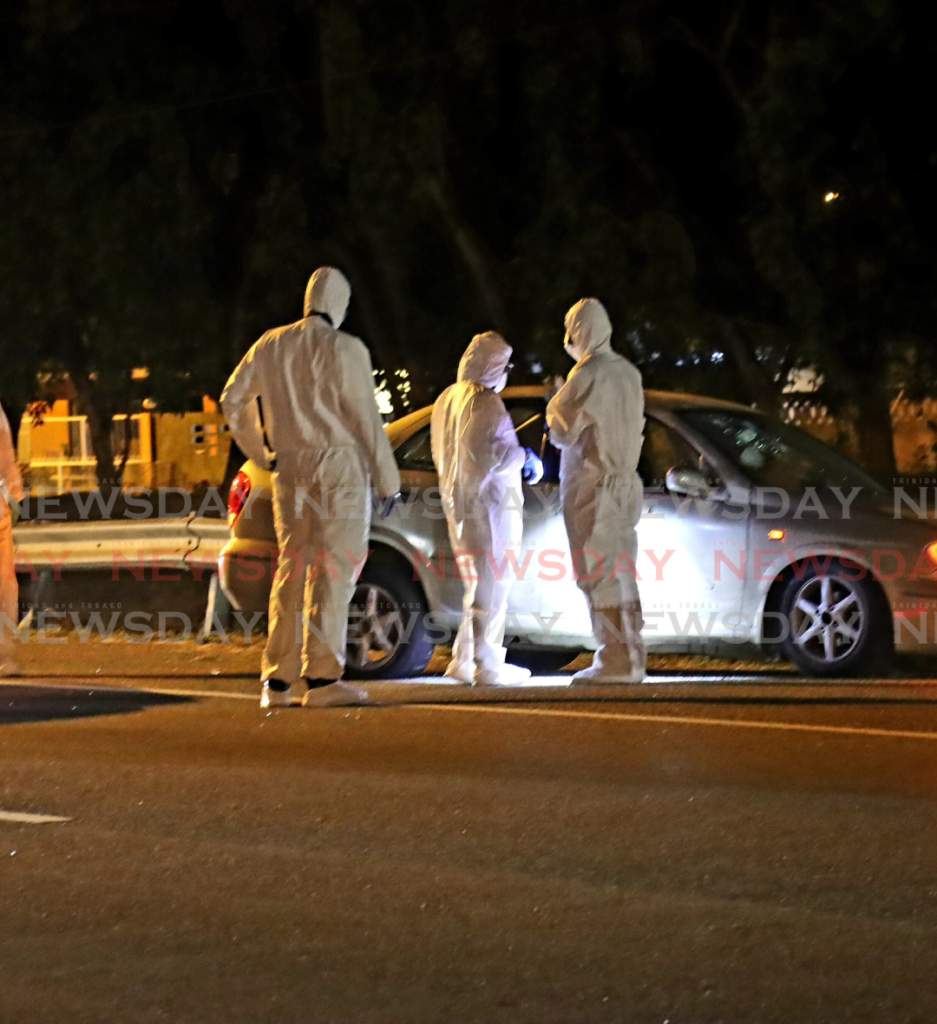 Crime scene investigators on a crime scene. - File photo by Roger Jacob 