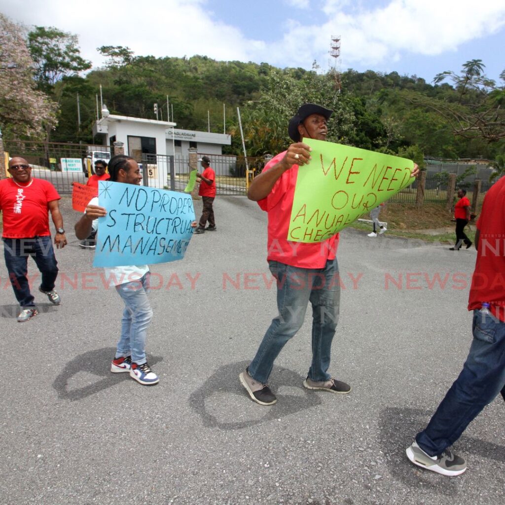 National Union of Government & Federated Workers protest outside the Chaguaramas Development Authority on Tuesday. Photo by Angelo Marcelle