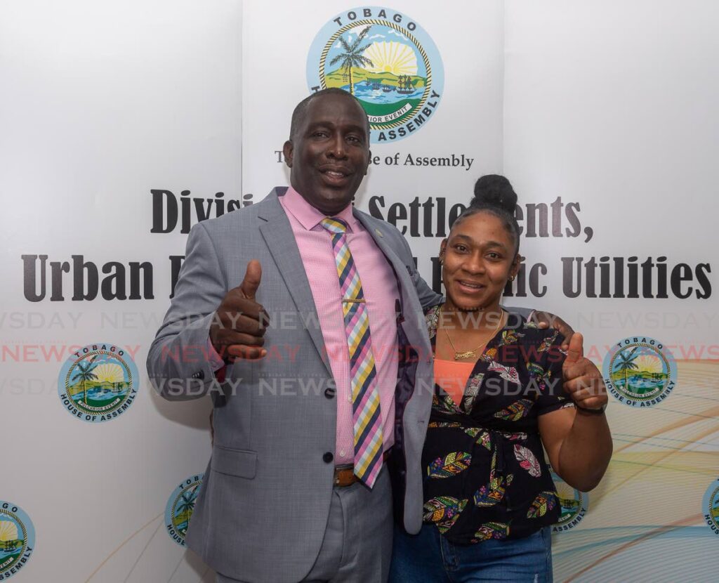 Secretary of Settlements Ian Pollard, left, hugs Yolanda Moreno after she was selected at a draw at the Division of Settlements, Crown Point, to receive a THA house at Riseland in 2022. Public consultations have begun for 53 new units in Riseland. - File photo/David Reid