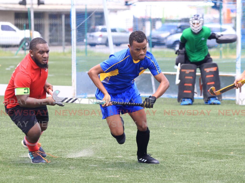 Paragon’s Kelon Skeritt, left, and Fatima’s Caleb Guiseppi go after the ball during the TT Hockey Board’s Hockey 5s game, at the Barracks in St. James, on Sunday, Paragon won 2-1. - AYANNA KINSALE