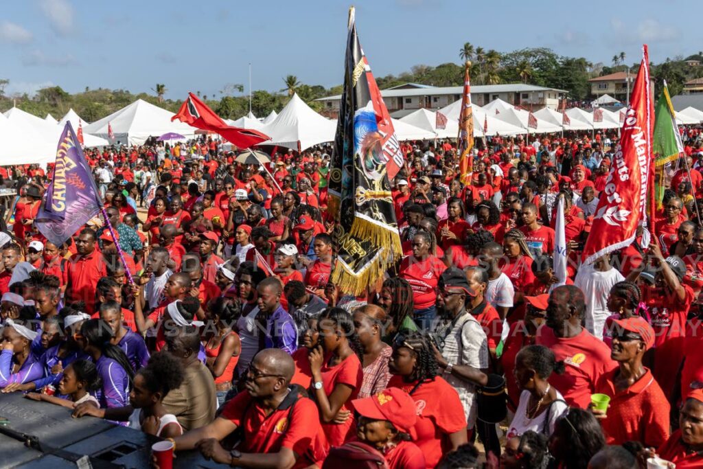 The crowd at a PNM Sports and Family Day at the Toco Secondary School, listens to an address by Prime Minister Dr Keith Rowley on Sunday. - Jeff K. Mayers