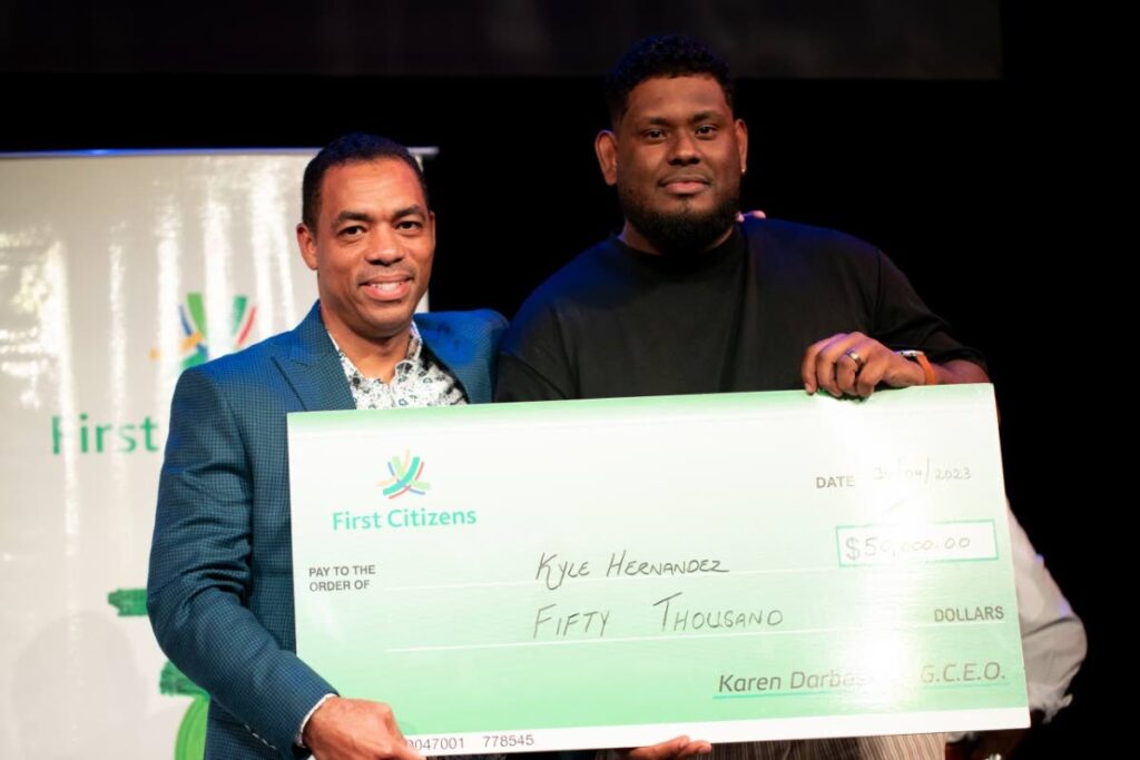 Jason Julien, deputy CEO, business generation, First Citizens, left, with  Kyle Hernandez, winner of the 2023 First Citizens National Poetry Slam.  - 