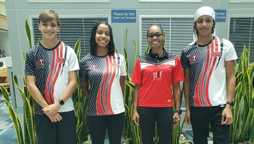 Trinidad and Tobago triathletes Noah Teixeira, left, Jacob Cox, right, and Jenae Price, second from left, with coach Aliya Drakes. - 