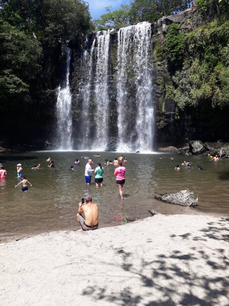 Visitors flock to the Llanos de Cortes waterfall. - 