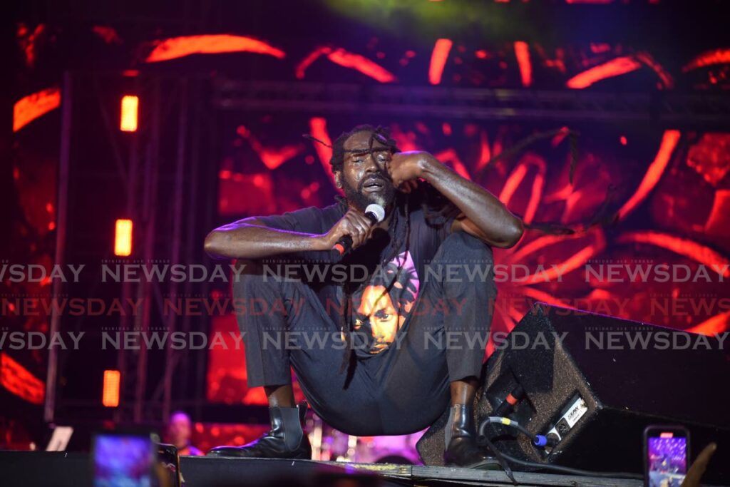 MUSICAL POINT: Mark Myrie aka Buju Banton raises a point with the audience during his performance at the Redemption 8 reggae concert.  PHOTO BY JEFF MAYERS - 