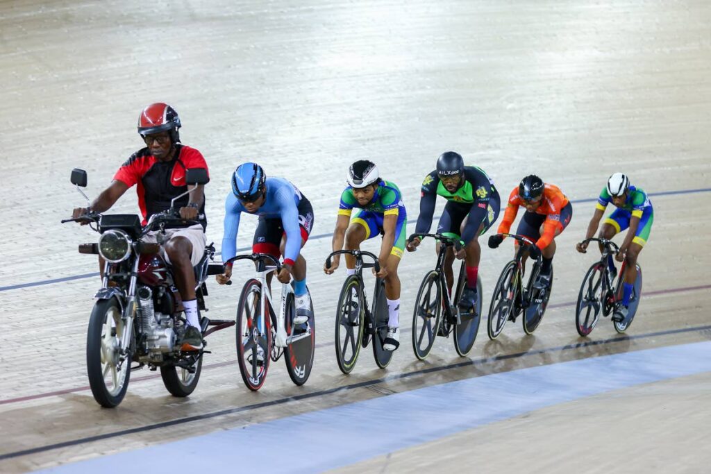 Central Spokes' Nicholas Paul (second from right) competes in heat two of the Elite Men's Keirin race during the TTCF National Track Championship at the National Cycling Center on Sunday in Balmain, Couva - DANIEL PRENTICE