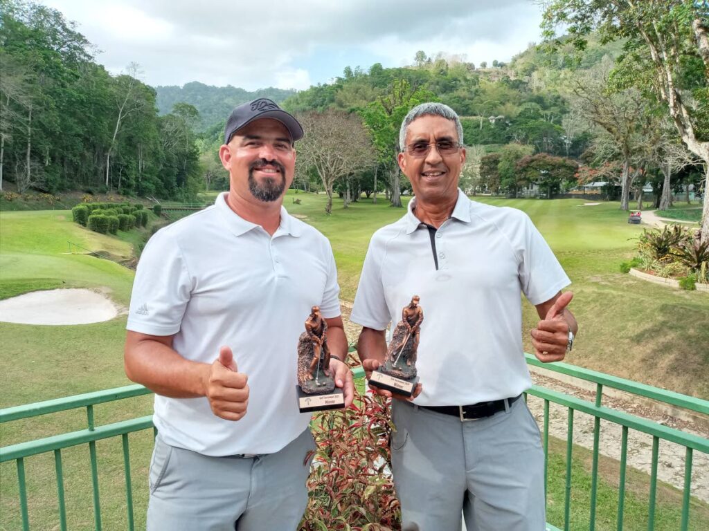 Winners of the 18th Cotton Tree Foundation Annual Charity Golf tournament held at St Andrews Golf Course in Moka, Maraval on Wednesday. Jonathan Augustus, left, and Adrian Sampson represented Lange Trinidad. - Jelani Beckles